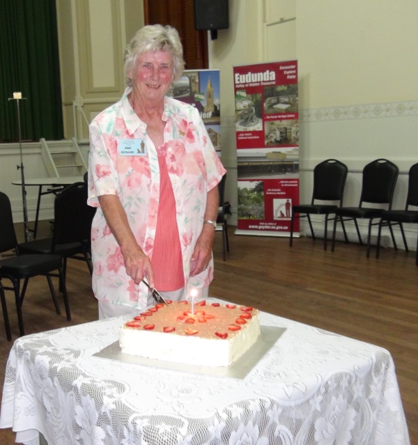 Eudundas Citizen of the Year Pam Dutschke cutting the Heritage Gallery Birthday Cake Feb 2017