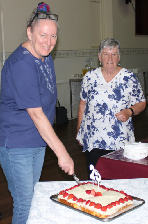 Deb Koodrin cuts the 25th Cake