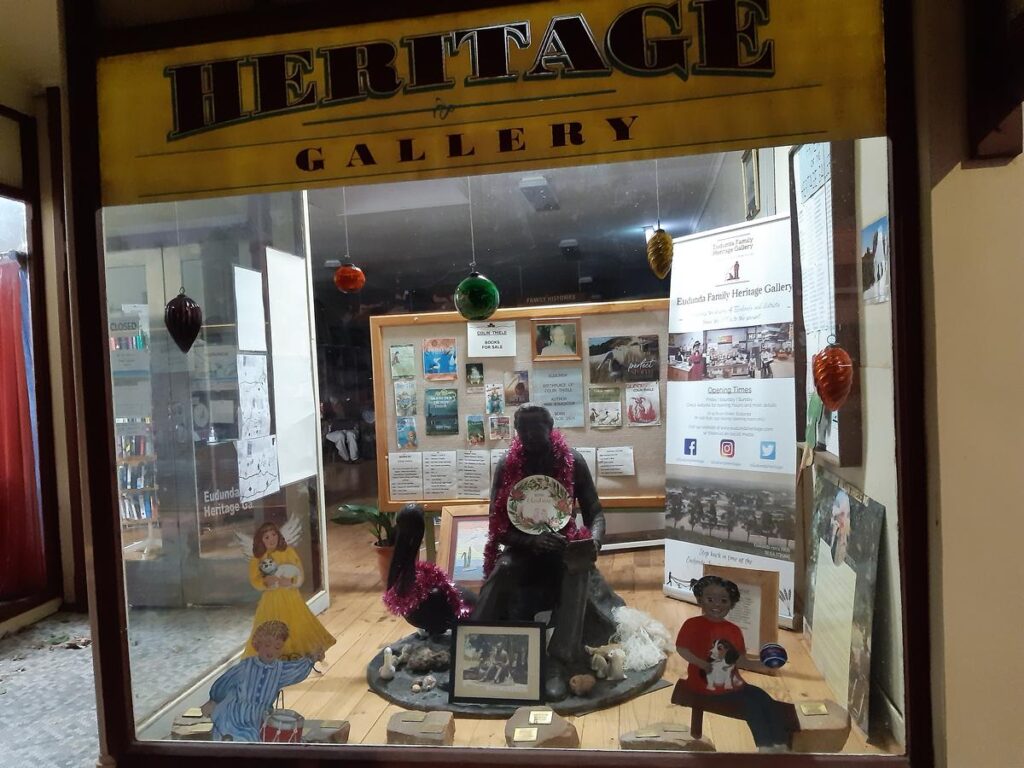 Eudunda Family Heritage Gallery Window display - Dec 2022 - Colin Thiele Sculpture gets in the fun